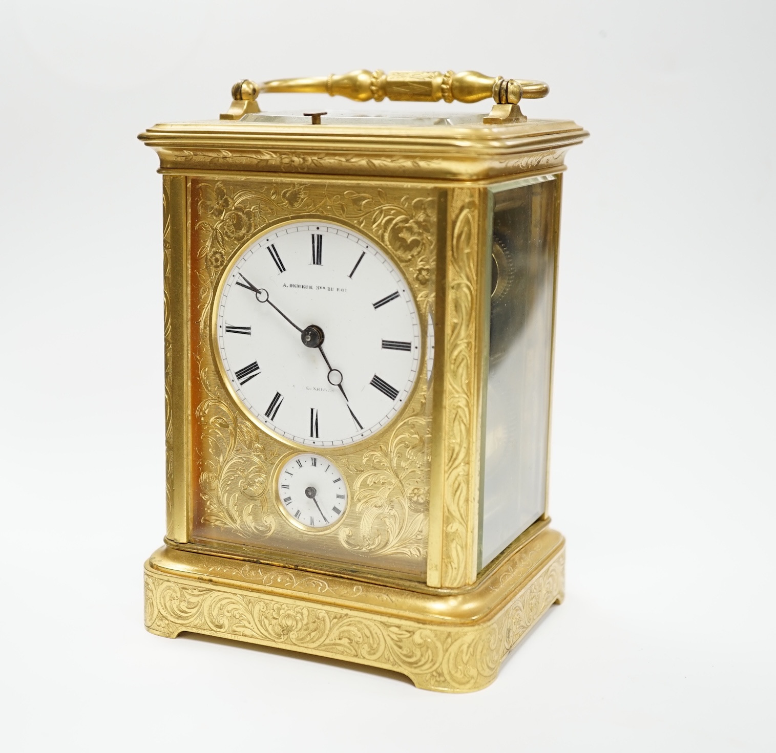 A late 19th century engraved brass cased repeating alarm carriage clock, dial signed Demeur, Her du Roi, Bruxelles, height 13cm.